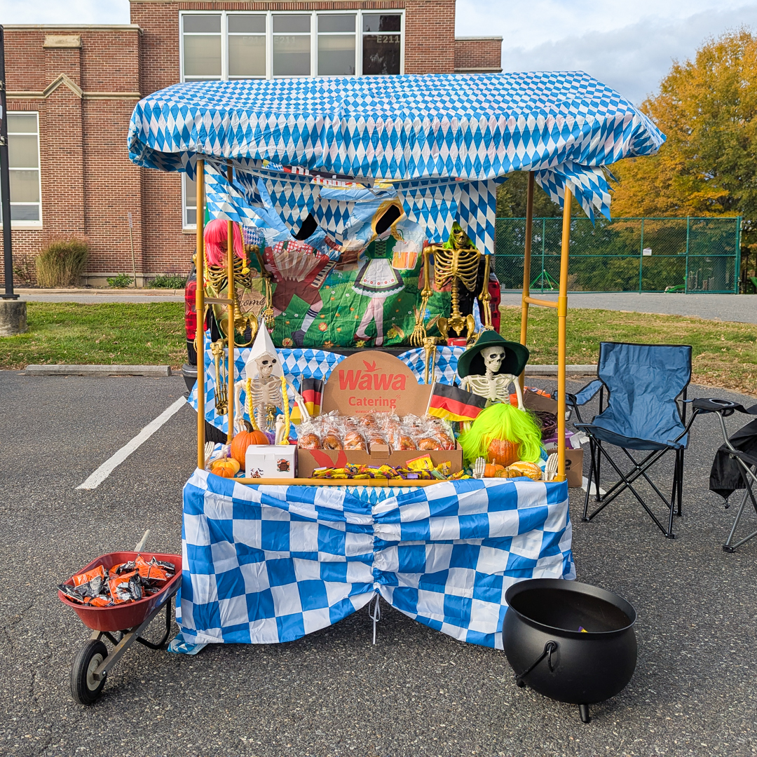 Oktoberfest inspired trunk with blue and white checkered designs and lots of skeletons