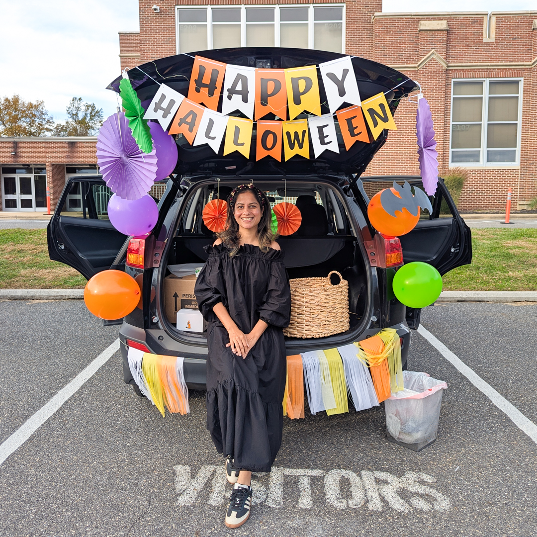 Orange, purple, and white trunk with Happy Halloween banner along the top of the trunk