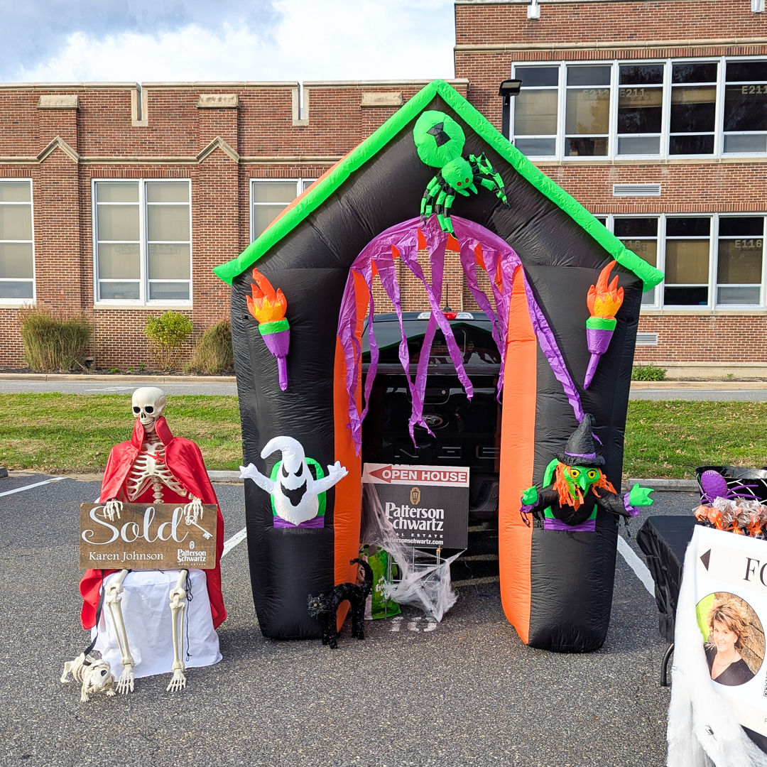 Blow up front door of a haunted house in front of a trunk as a decoration