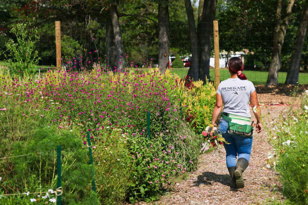 Owner Erin Cech walking at Renegade Flower Farm