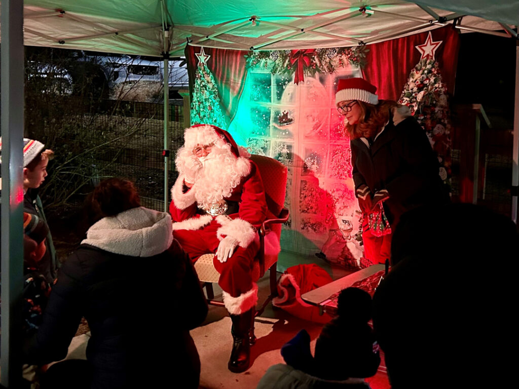 Santa sitting waiting for the next child to take a photo with him