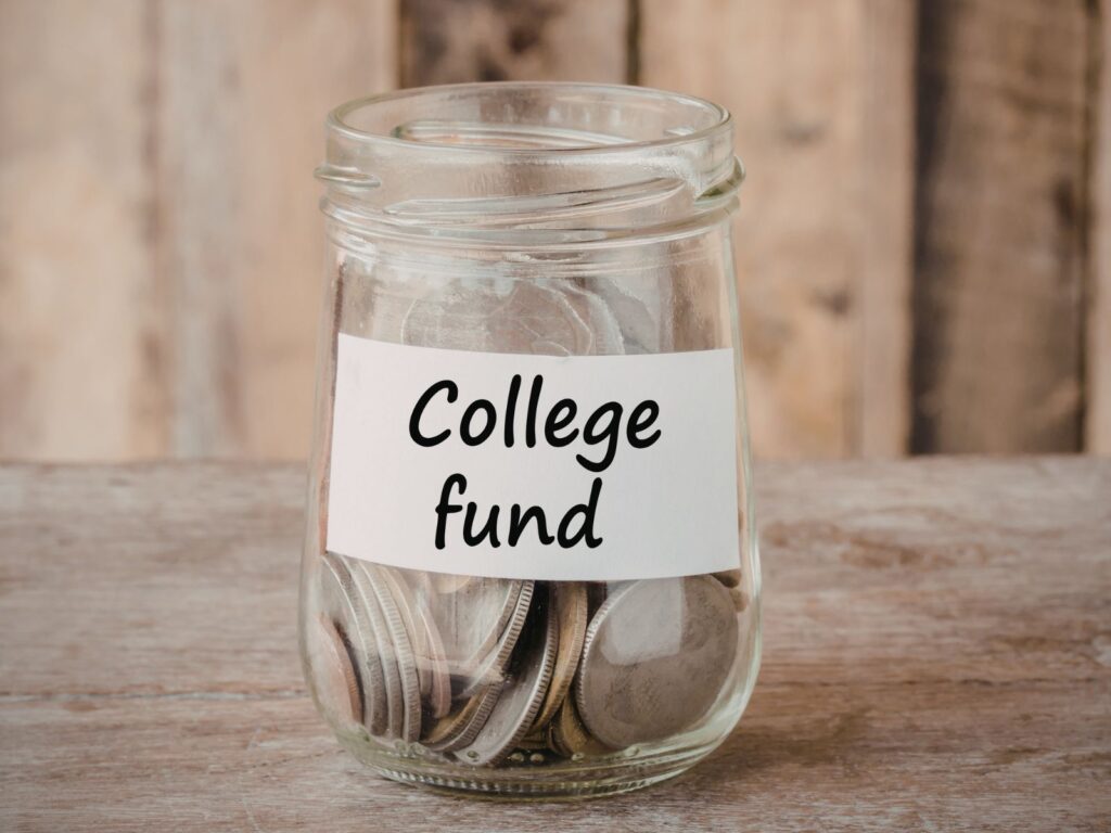 glass with coins in it a label that says college fund