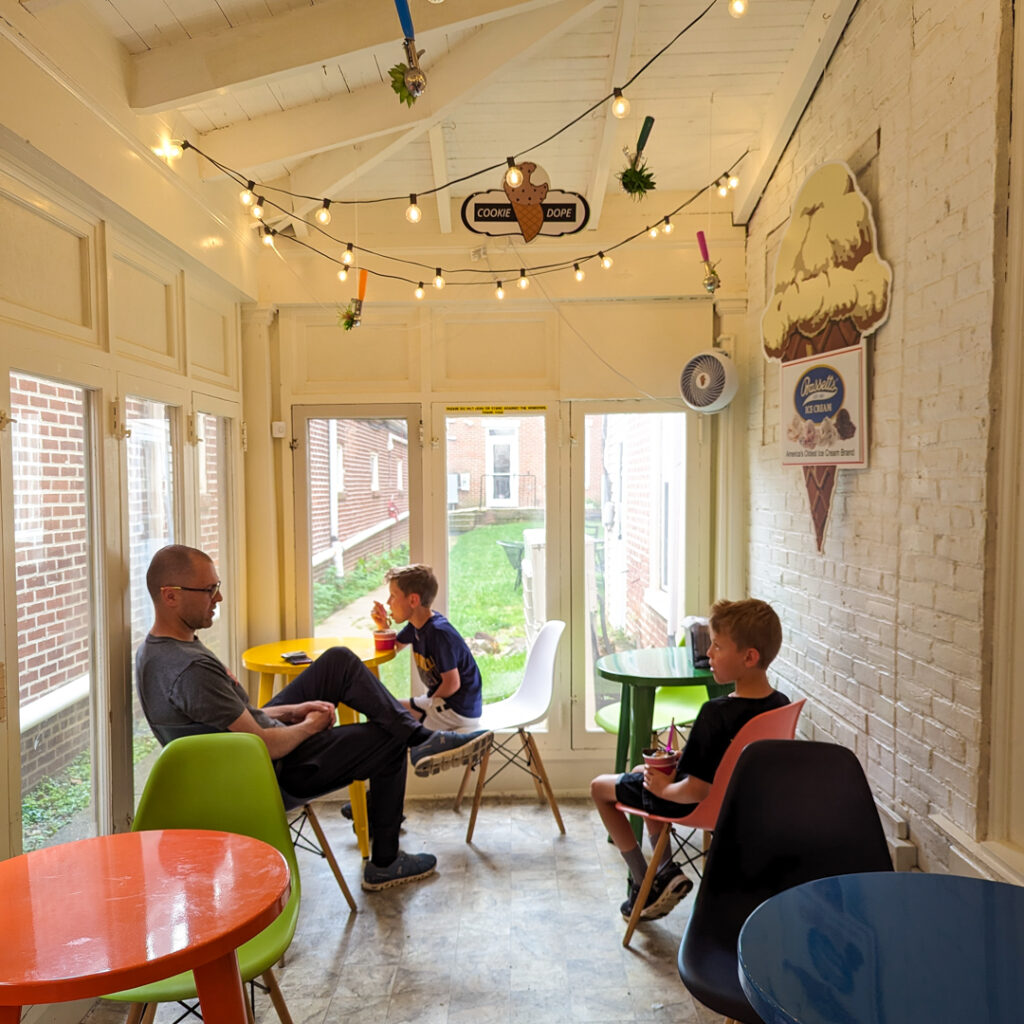 dad and two sons eating ice cream at Cookie Dope