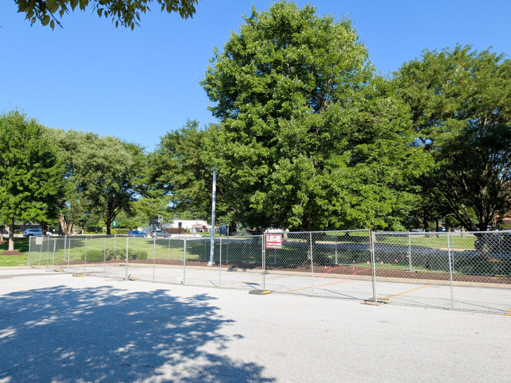 construction fences up in anticipation of a new IONNA EV charging location
