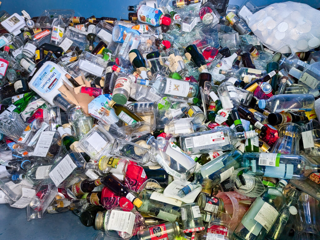 Glass bottles and jars inside the glass collection bin at Concord Township