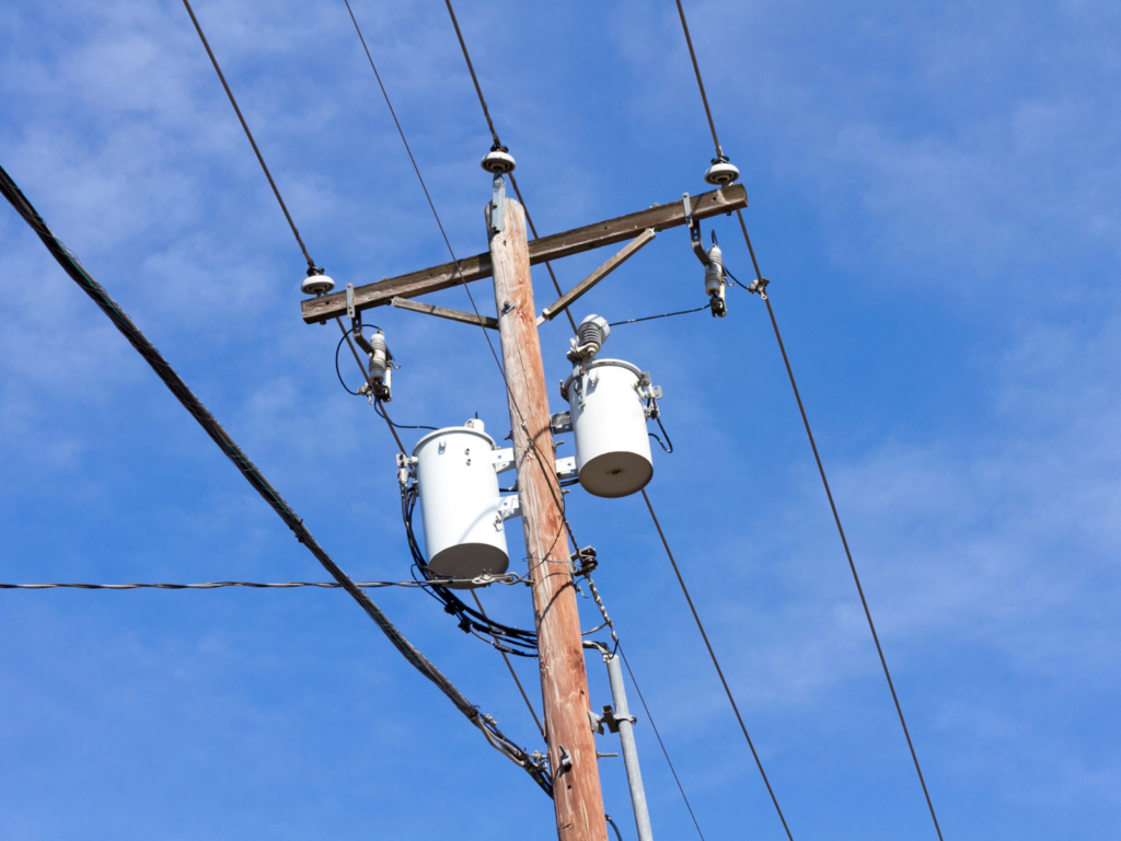 power lines; representing Williams' signature energy bill