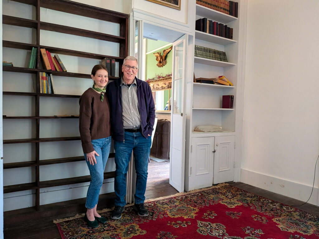 Emma Leuschner (right) and Ed Worteck, cofounders of the Painter's Folly Preservation Alliance and passionate stewards of this home's history.